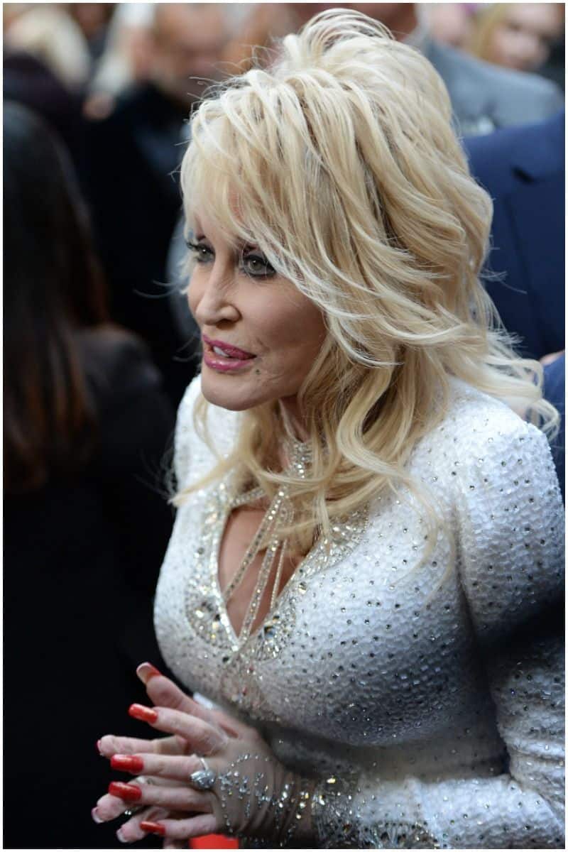 Why does Dolly Parton wear long sleeves