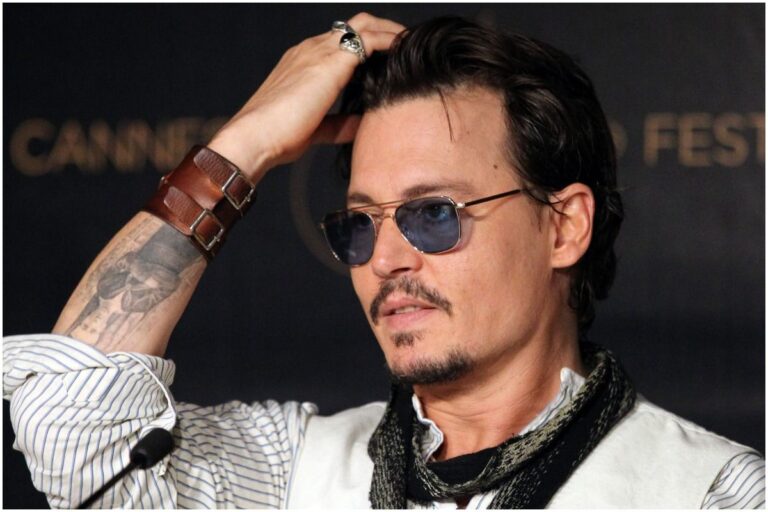 Whose name did Johnny Depp have tattooed on his arm in 1990