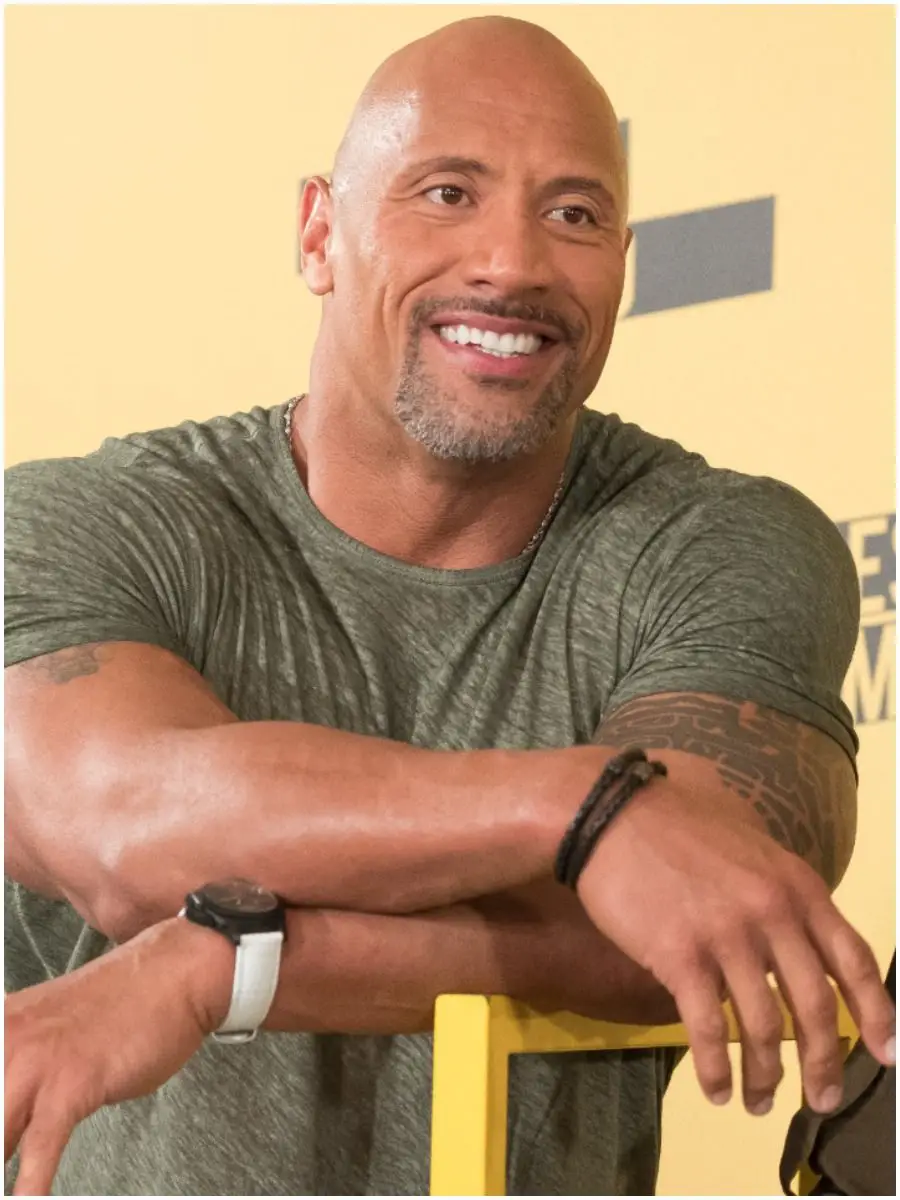 how are the rock and roman reigns related